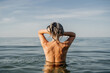 © Alba Vitta/Stocksy - Active mature woman bathing in the sea in the morning