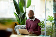 © ALTO IMAGES/Stocksy - Black entrepreneur working on laptop