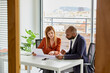 © ALTO IMAGES/Stocksy - Financial advisor talking to a customer