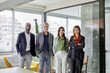 © ALTO IMAGES/Stocksy - Company associates standing together
