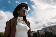Fashionable Woman In Trendy Outfit And Sunglasses In City