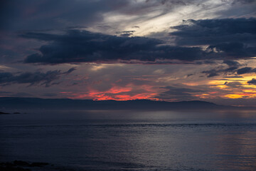 Wall Mural - Evolution of the storm on the Cantabrian coast until the spectacular multicolored sunset!