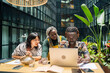 © Luis Velasco/Stocksy - Entrepreneurs Sitting Around The Table In The Office.