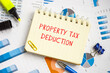  Property Tax Deduction sign on the piece of paper.
