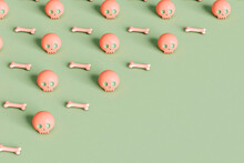 Pink Skulls And Bone On Green Background