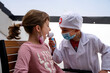 © Albert Martinez/Stocksy - Little brothers playing doctor.