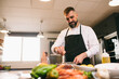 © Inuk Studio/Stocksy - Bearded chef preparing sauce in kitchen