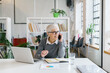 © Mihajlo Ckovric/Stocksy - Senior businesswoman talking on the phone in office
