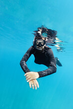 Man Snorkeling In The Blue Sea