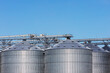 © Luis Cerdeira/Stocksy - Agriculture storage tanks