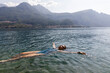 © Michela Ravasio/Stocksy - Beautiful woman floating in the lake
