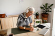 © Eloisa Ramos/Stocksy - Bussinesswoman working at workplace