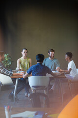 Poster - Lens flare over creative business people meeting at office table