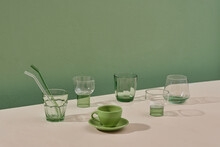 Set Of Transparent, Green Crystal Glasses Of Different Shapes
