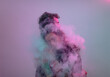 © Ibai Acevedo/Stocksy - Couple hug inside a smoke cloud