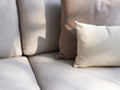 © Miquel Llonch/Stocksy - Small and big cushions on couch.
