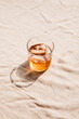 © Anna Tabakova/Stocksy - Sun coming through an iced dark liquor