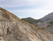 © Silvia Cipriani/Stocksy - Man hiking on a dry land area