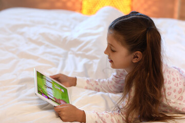 Canvas Print - Cute girl watching cartoons in bedroom