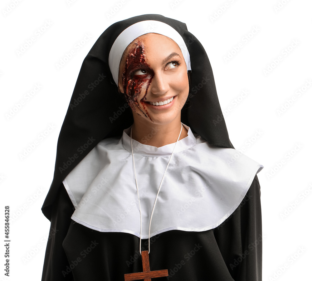 Woman dressed for Halloween as nun on white background