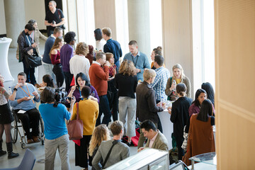 Canvas Print - People talking during conference break