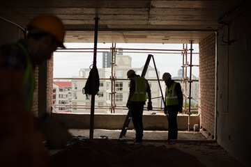 Wall Mural - Construction workers at construction site