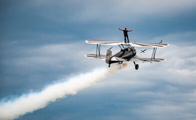 Wing Walking on Top of a Biplane