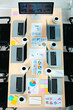 © Bangkok Click Studio - Top view shot of conference meeting table in empty company office room full of laptop computers black hot coffee in white cups report data paperwork documents post it and black chairs