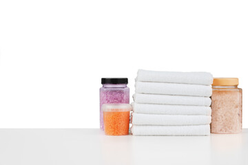 Wall Mural - Composition of cosmetic bottles and towels isolated on white