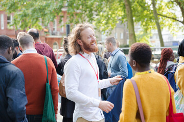 people talking outside auditorium