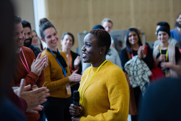 Wall Mural - Female speaker talking to audience