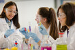 © KOTO - Girl students conducting scientific experiment in laboratory classroom