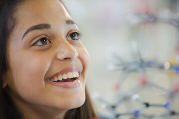 Wall Mural - curious girl student examining molecular structure