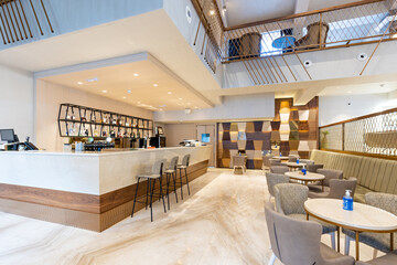 Interior of a spacious cafe bar in hotel lobby