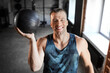 © Syda Productions - sport, bodybuilding, fitness and people concept - happy smiling young man with medicine ball in gym