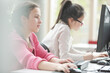 © KOTO - Girl students working at computer in library