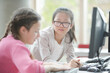 © KOTO - Girl students working at computer in library