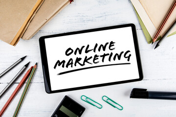 Canvas Print - Online Marketing. Tablet and office supplies on a wooden table