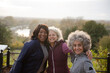 Active senior women friends in autumn park
