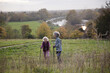 © KOTO - Active senior women friends with walking sticks in autumn park