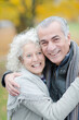 © KOTO - Portrait smiling, affectionate senior couple hugging in park