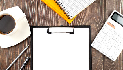 Poster - White cup of hot coffee and notebook and paper , calculator on wood table