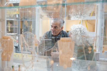 Canvas Print - Senior couple window shopping at jewelry storefront