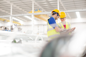 workers with digital tablet working in factory