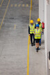 © KOTO - Supervisor and workers walking in factory