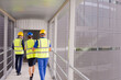 © KOTO - Supervisors and worker walking in factory