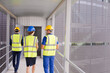 © KOTO - Supervisors and worker walking in factory