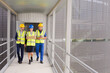 © KOTO - Supervisors and worker walking in factory