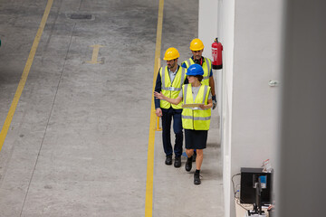 Wall Mural - Supervisor and workers talking in factory