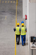 © KOTO - Supervisor and workers walking in factory